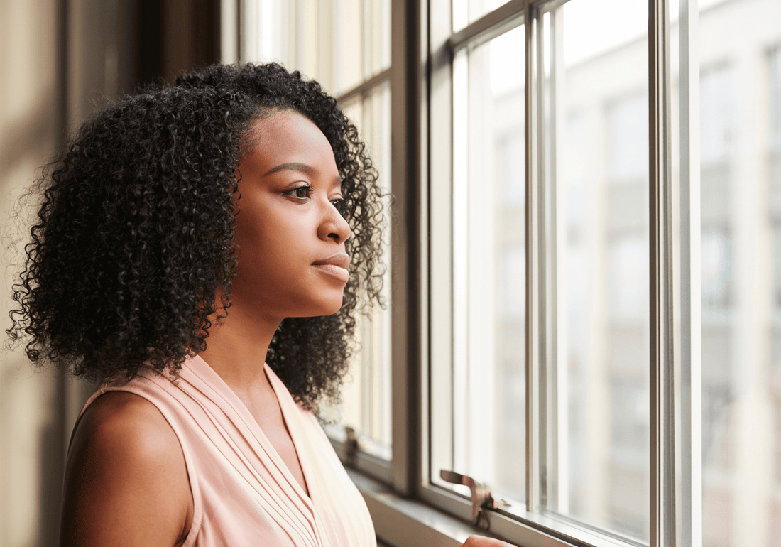 Woman reflecting after failed IVF despite good embryo